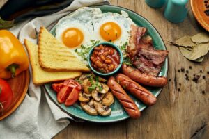 classic english breakfast toasts smoked sausages bacon fried eggs beans fried toasts blue plate top view horizontal wooden surface 207126 401 classic english breakfast toasts smoked sausages bacon fried eggs beans fried toasts blue plate top view horizontal wooden surface 207126 401